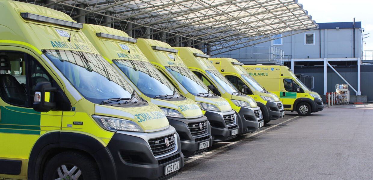 a row of ambulances outside hospital