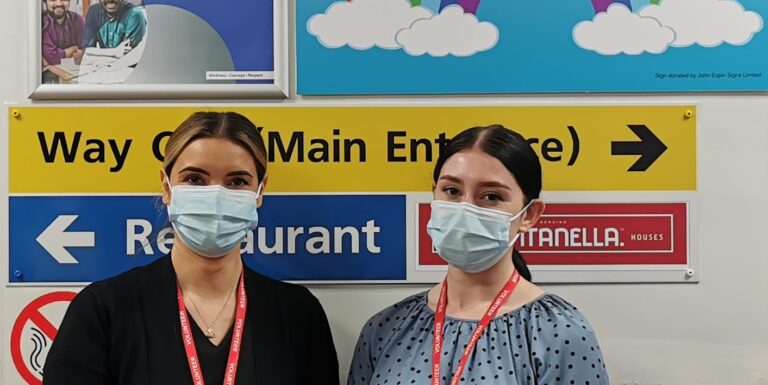 two women stood outside a ward