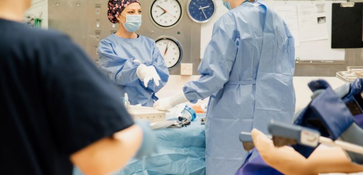 staff in theatre scrubs and hats